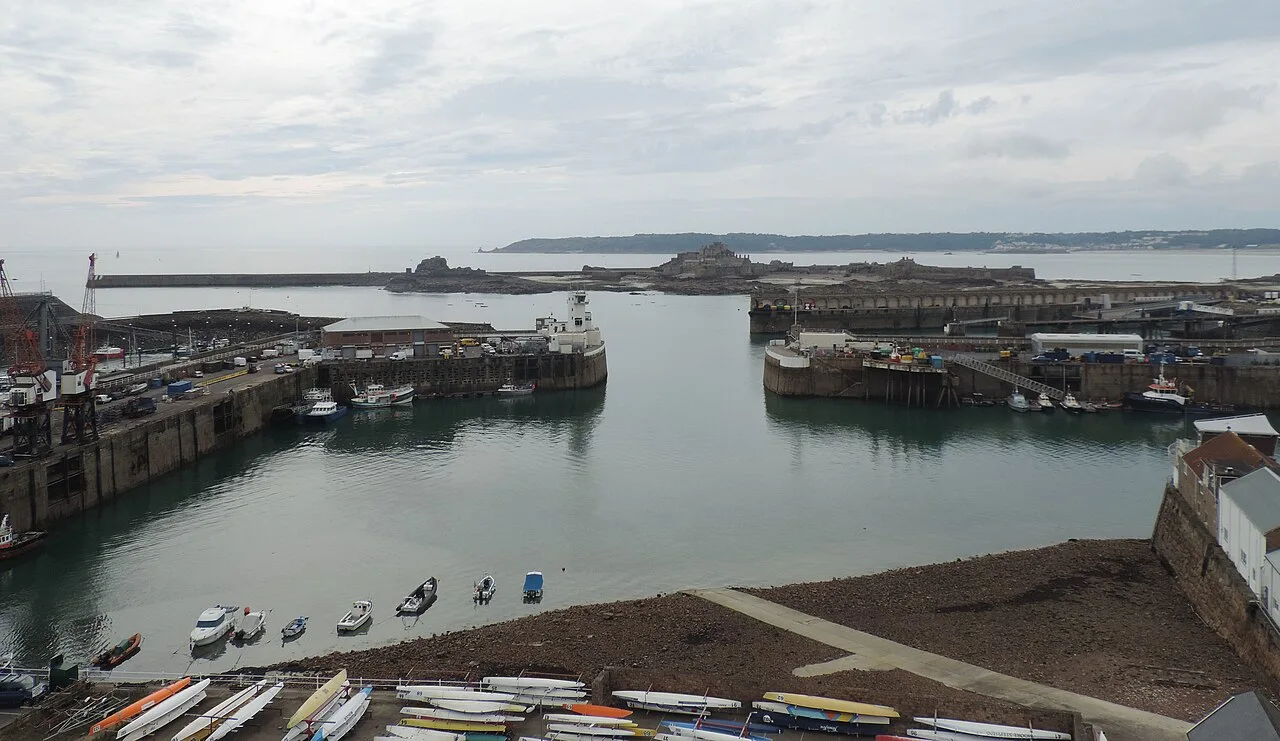 Saint Helier Harbour, Jersey, and the islet with Elizabeth Castle in the background.