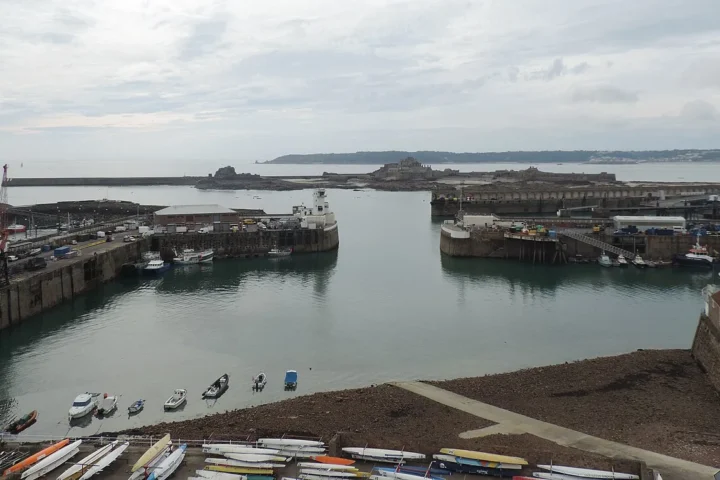 Saint Helier Harbour, Jersey, and the islet with Elizabeth Castle in the background.